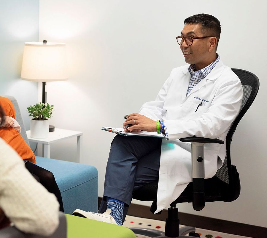 Christian Charvet, PMHNP-BC, meeting with a patient at LumiClinics in Northbrook