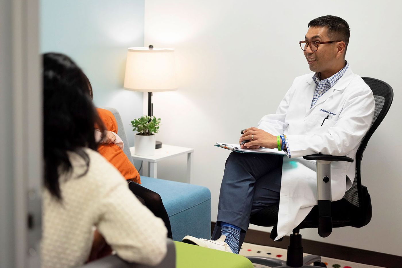 Christian Charvet, PMHNP-BC, in conversation with a patient at the Northbrook office