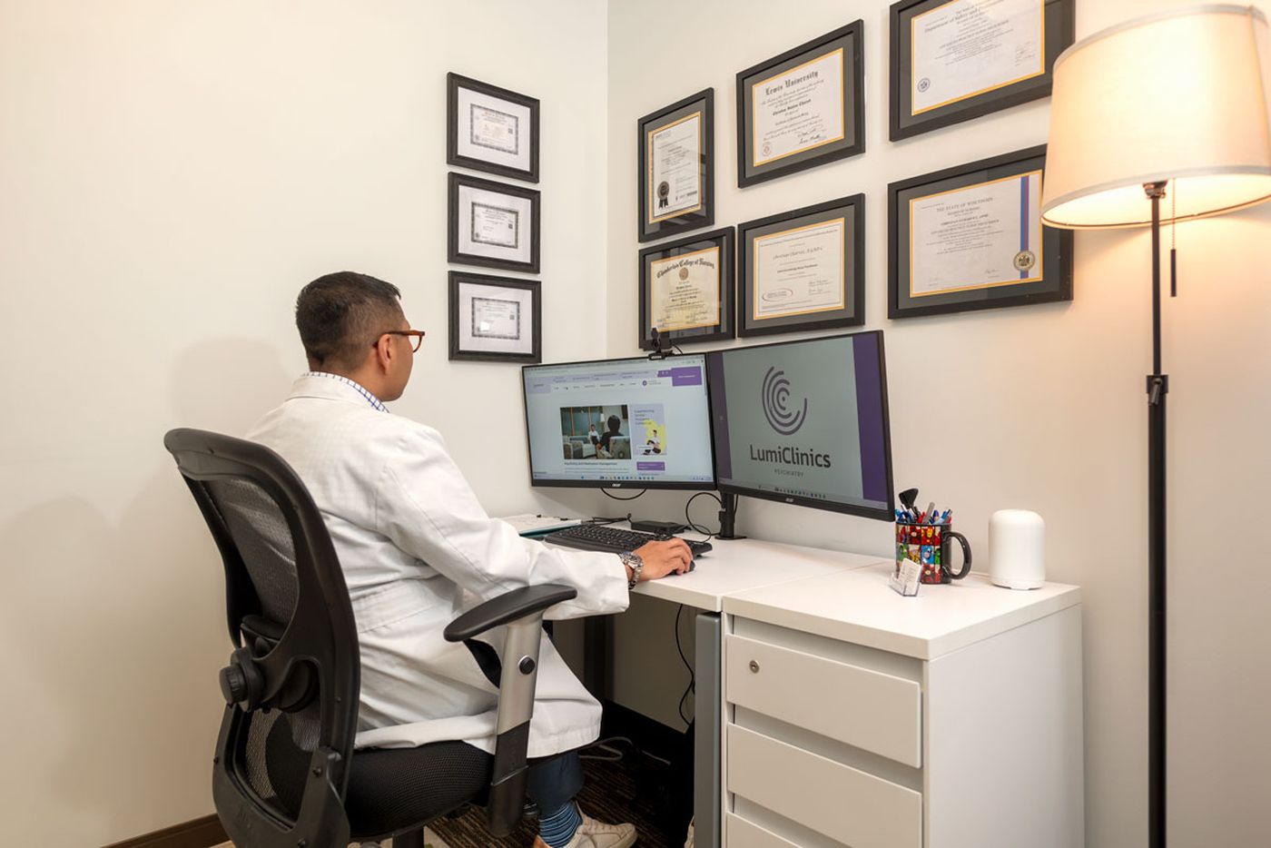 Christian Charvet reviewing assessment results at a workstation in the Northbrook office